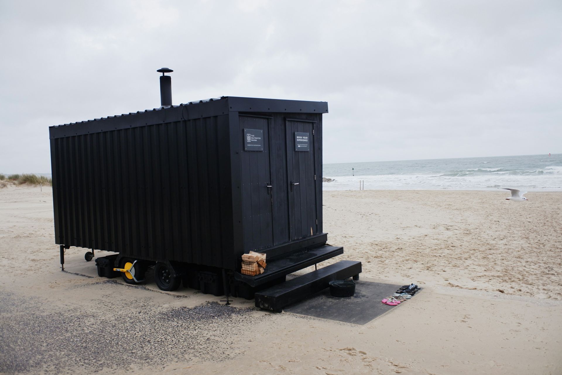 a black rectangular object on a beach